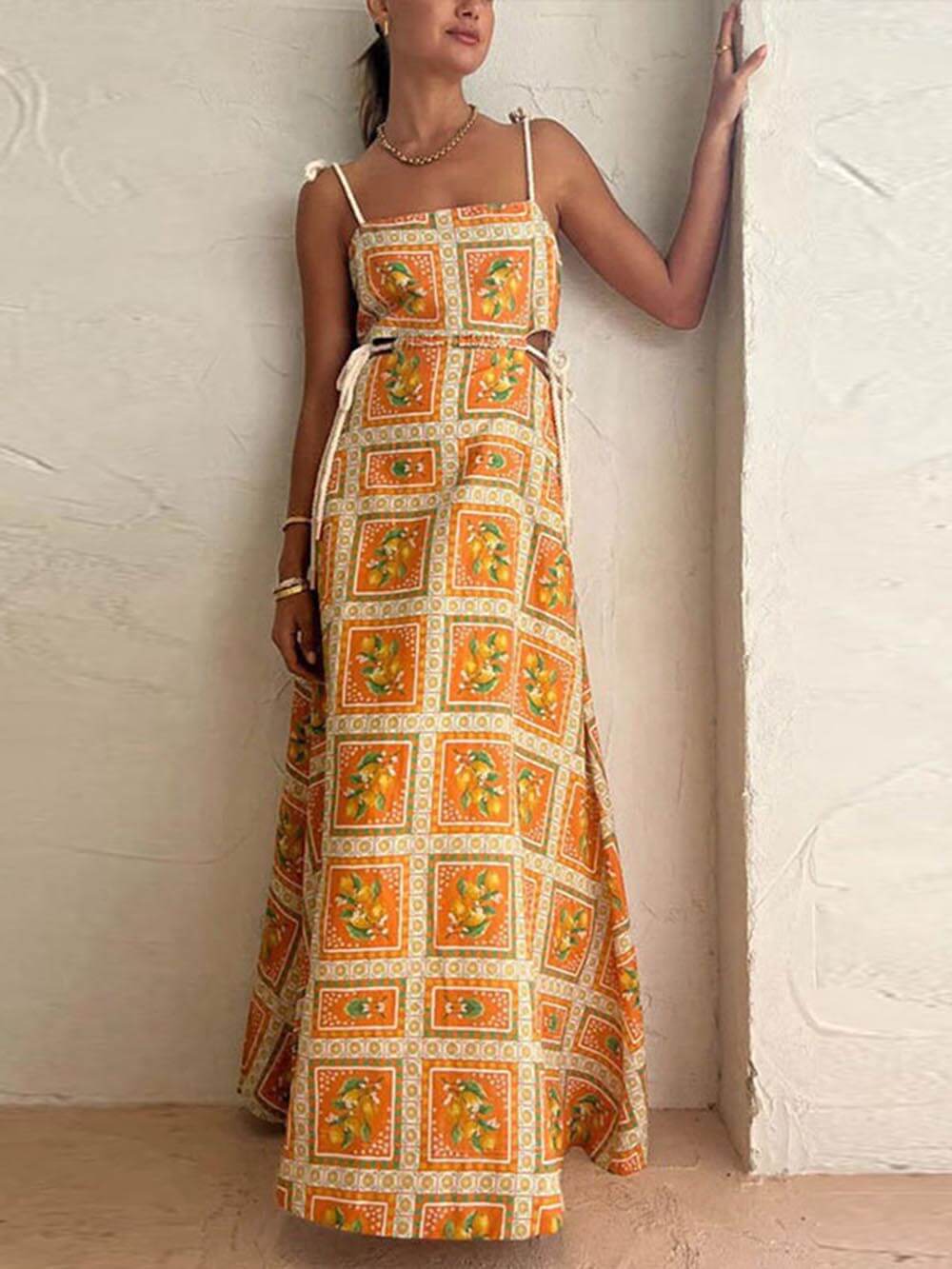 Stylish women's square neck maxi sundress in orange, a flowing boho dress for elegant summer fashion.