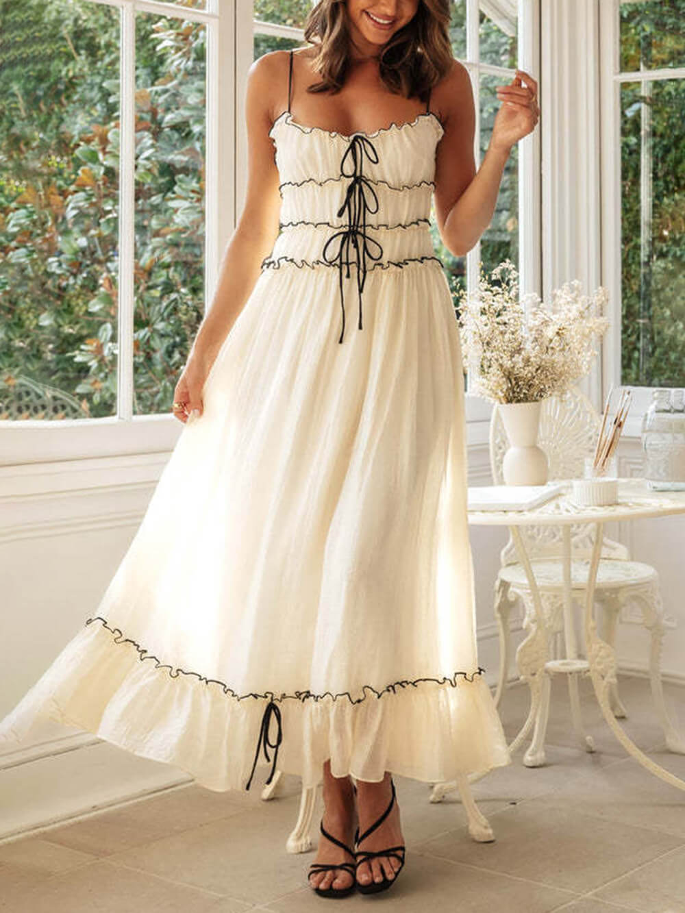 Boho midi dress for women, sleeveless and white, featuring adjustable spaghetti straps. Perfect sundress.