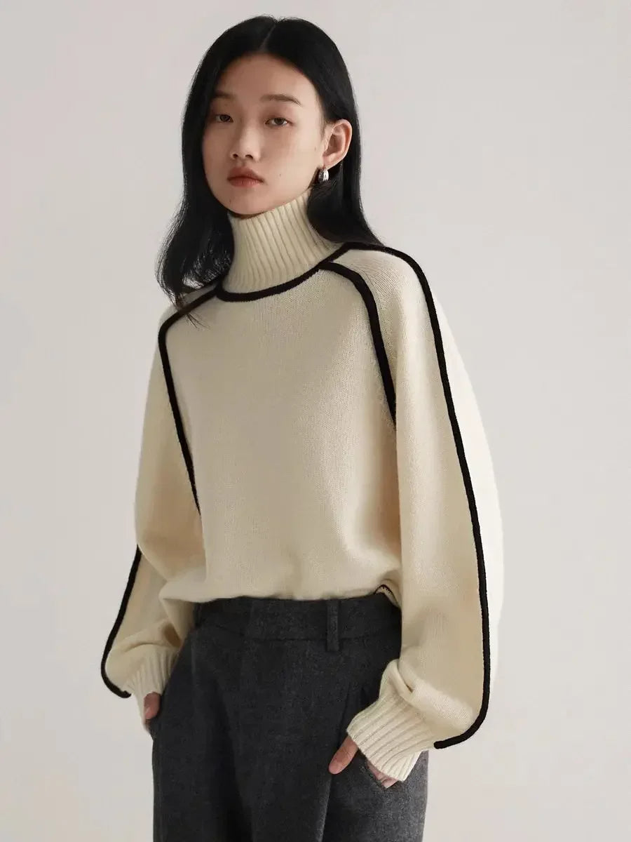 Cozy and chic women's turtleneck sweater. Contrast seams add modern flair to versatile winter apparel.