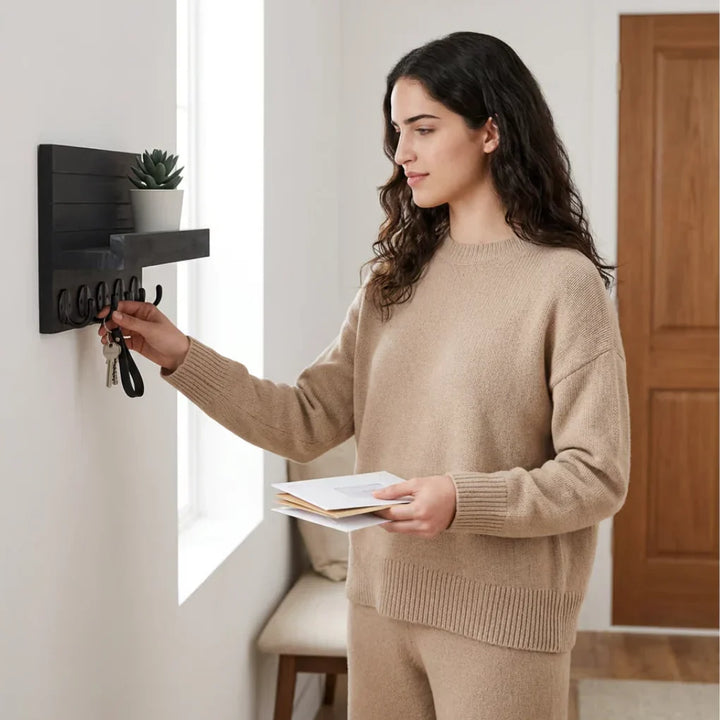 Modern entryway wall key & mail holder in black paulownia wood, featuring a shelf and hooks for home organization.