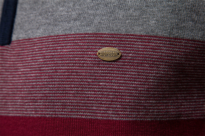 Men's grey colorblock half-zip sweater, essential for modern layering and casual appeal.