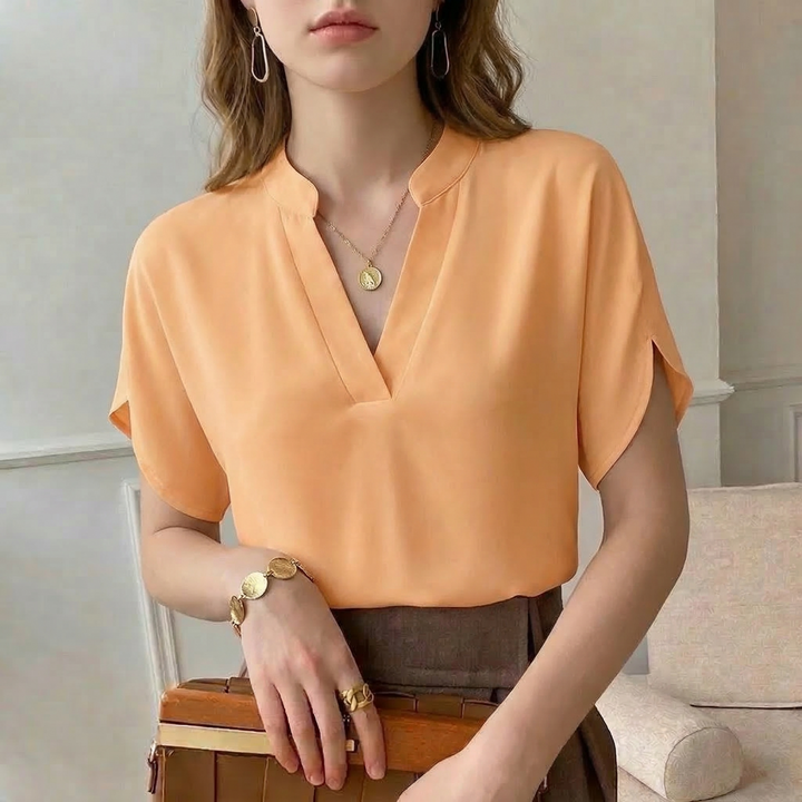 Elegant women's flowing blouse, perfect for versatile office or party wear. Comfortable premium fashion top.