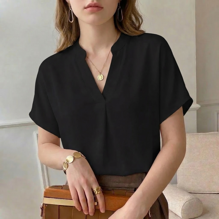 Chic women's flowing blouse, ideal for office meetings or elegant party evenings. Comfortable fashion top.
