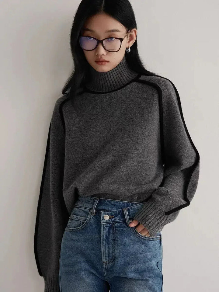 Stylish women's turtleneck sweater featuring unique contrast seams. Effortless, chic fall and winter everyday wear.