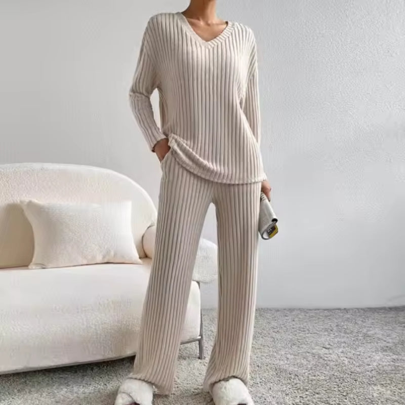 Women's cozy ribbed knit loungewear set. Two-piece matching outfit with V-neck top & comfortable trousers for casual wear.