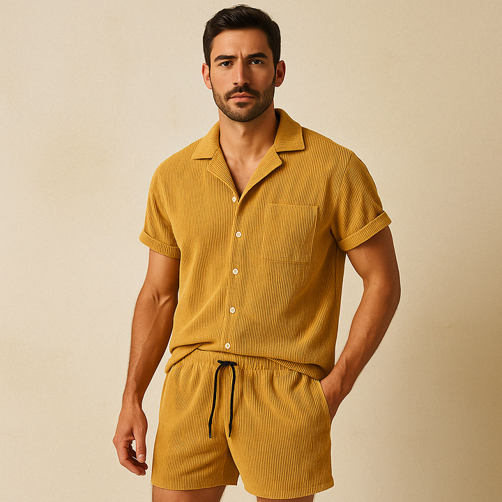 Woman wearing a relaxed two-piece summer set. Button-up shirt & drawstring shorts for effortless, comfortable casual wear.