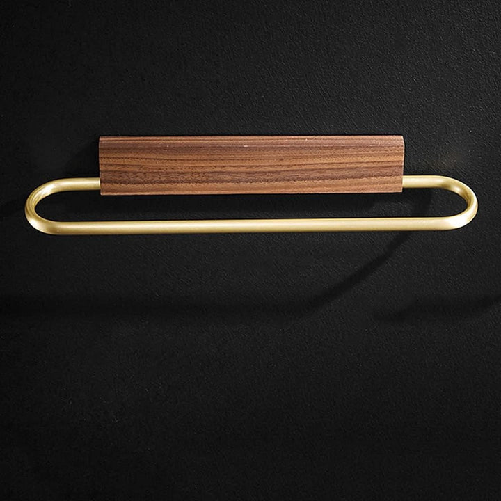 Modern walnut towel bar, wall mounted, with elegant brass hardware. Perfect for minimalist bathroom organization.