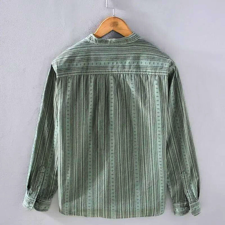 Chic green striped button-down shirt for women. Comfortable long-sleeve casual top, perfect for summer fashion & everyday wear.
