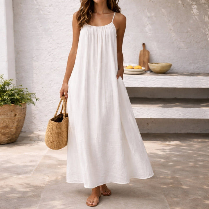 Flowy women's sleeveless maxi dress for warm weather, stylish casual sundress.