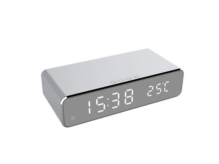 Versatile digital LED alarm clock & wireless phone charger; a sleek, modern bedside tech accessory in black.