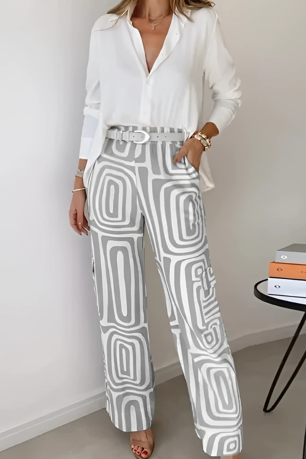 Professional women's two-piece office set featuring a chic blazer and comfortable wide-leg pants for workwear.