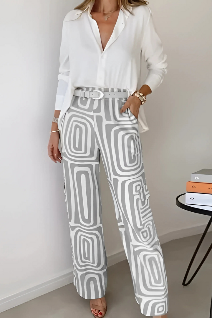Professional women's two-piece office set featuring a chic blazer and comfortable wide-leg pants for workwear.