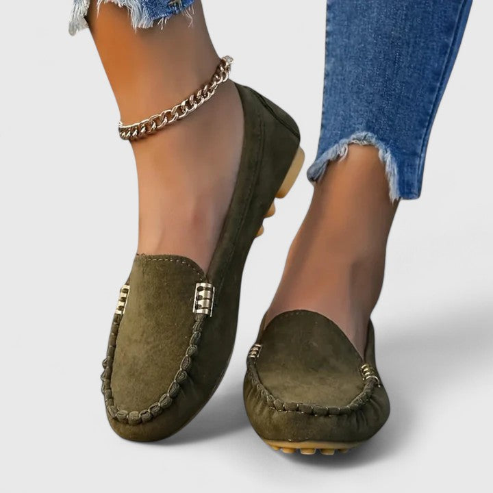 Women's elegant slip-on loafers with metal details, providing orthopedic support for comfortable steps.