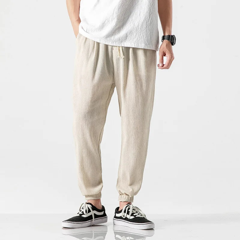 Black men's joggers with a relaxed fit and modern tapered leg, offering ultimate comfort for casual or active days.