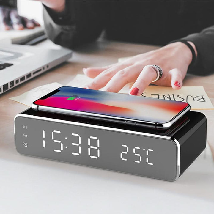 Convenient bedside LED digital alarm clock offering wireless phone charging. Modern gray tech accessory.