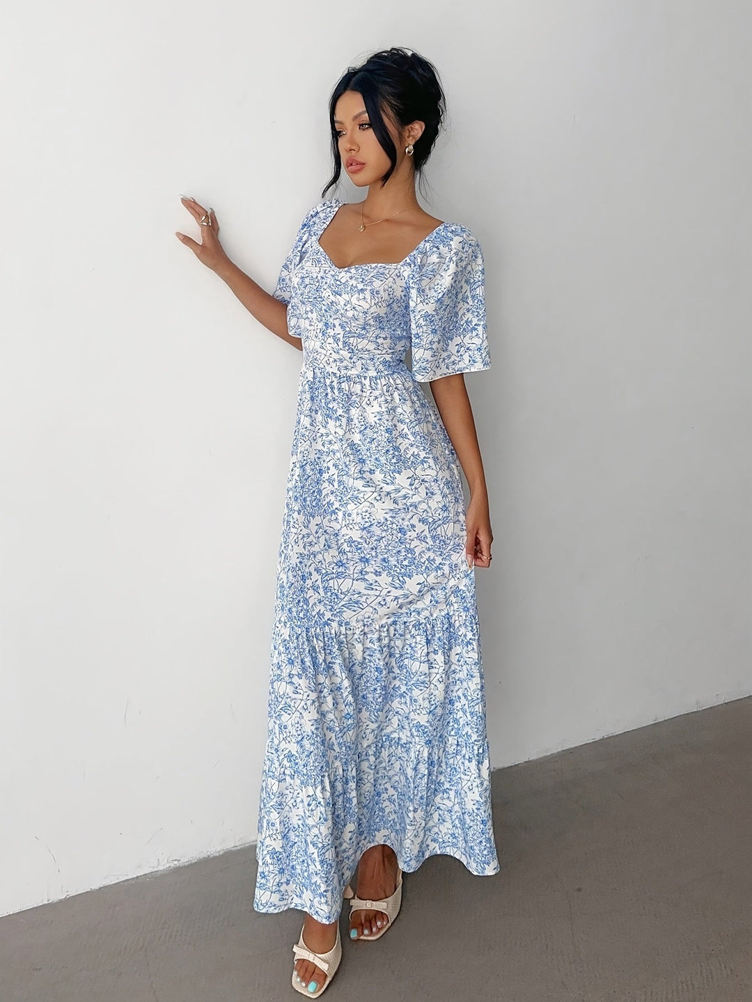 Stylish women's floral maxi dress, tiered design, sweetheart neckline for summer, elegant casual fashion.
