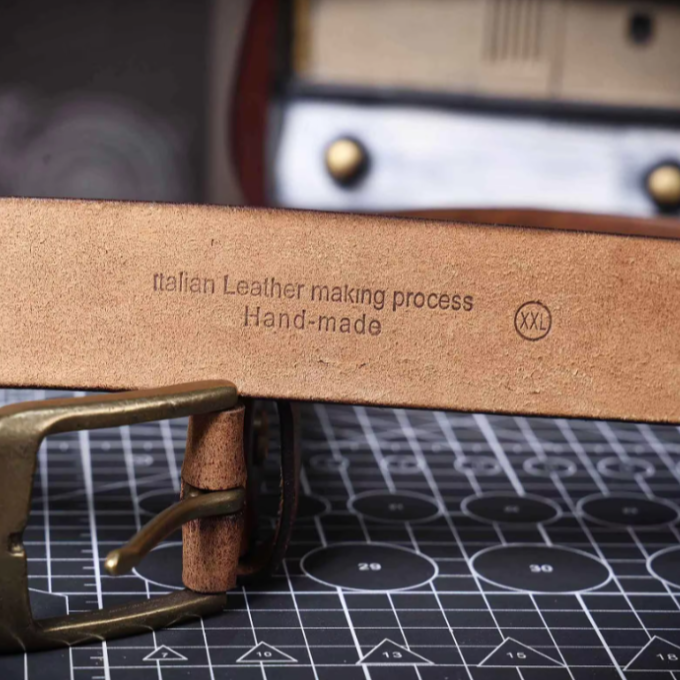Men's classic brown leather belt with a polished buckle, a durable fashion accessory.