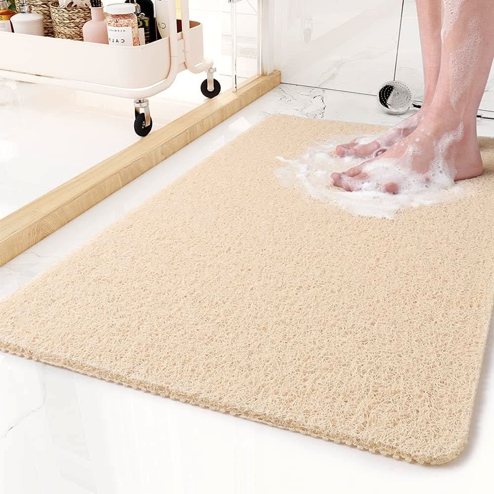 Hygienic drainage shower mat for quick dry comfort; anti-slip PVC bath mat for bathroom floors.