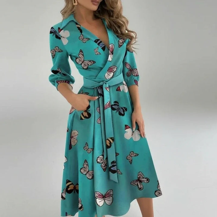 Stylish women's A-line midi dress with belt, V-neck, and 3/4 sleeves, perfect for casual or elegant looks.