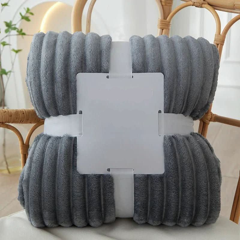 Plush striped flannel fleece blanket, offering cozy warmth and softness for your home.