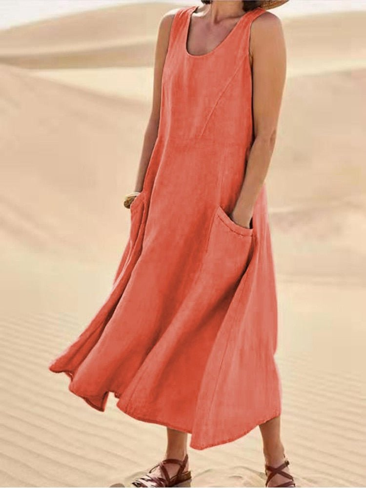 Sleeveless midi dress for women featuring a stylish scoop neck and functional pockets. Comfortable for summer.