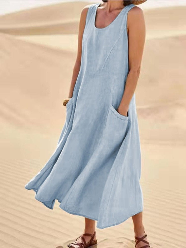 Stylish women's sleeveless midi dress, scoop-neck with convenient pockets. Versatile for casual, summer, and vacation.