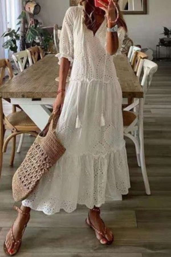 Boho-chic floral maxi dress with delicate tassels and a flattering V-neckline for women.