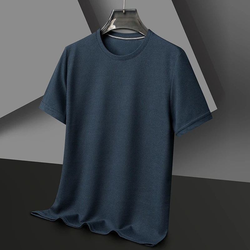 Model wearing a men's versatile waffle knit t-shirt, showcasing casual style and comfort.