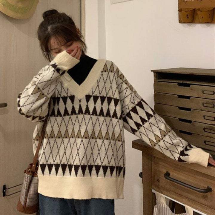 Versatile women's aesthetic long sleeve sweater, a chic top perfect for fall fashion and modern everyday apparel.