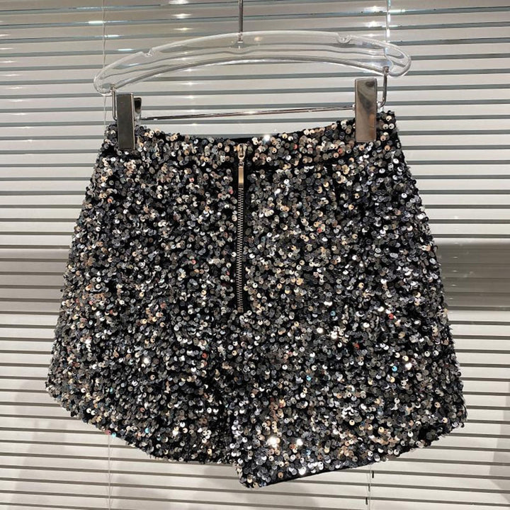 Stylish women's glitter shorts for a chic summer fashion statement. Trendy high-waist shimmer shorts, ideal for party wear.