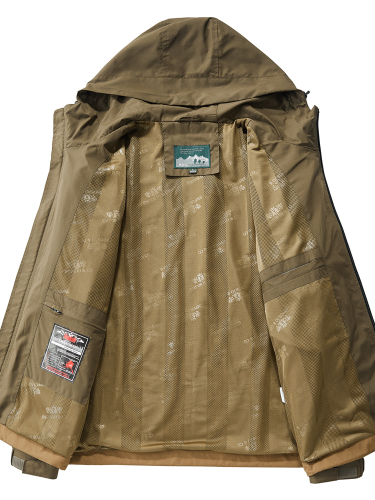 Close-up of men's tactical jacket material, highlighting durability. All-weather performance, lightweight design.