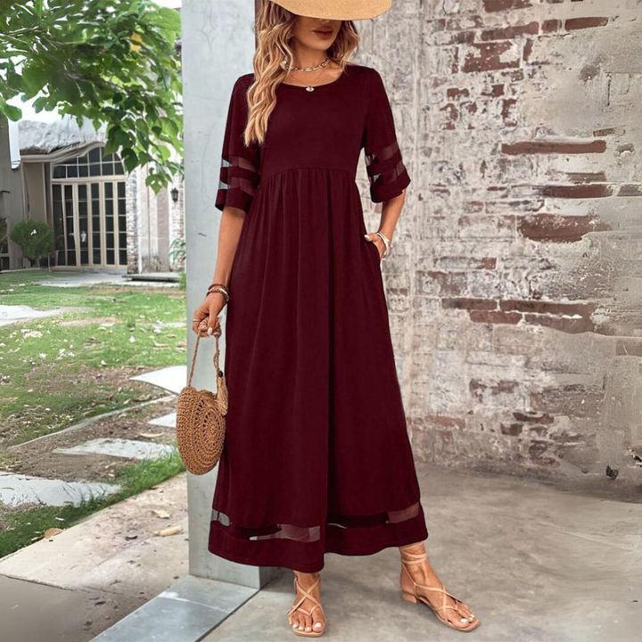 Women's Elegant Mesh Panel Gathered Maxi Dress. Features a round neck, 3/4 sleeves, and flowy silhouette.