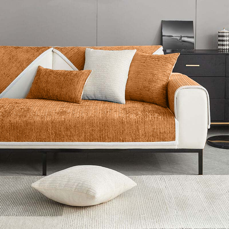 Modern waterproof sofa cover in a vibrant color, protecting against spills & pets. Ultimate, stylish, non-slip furniture guard.