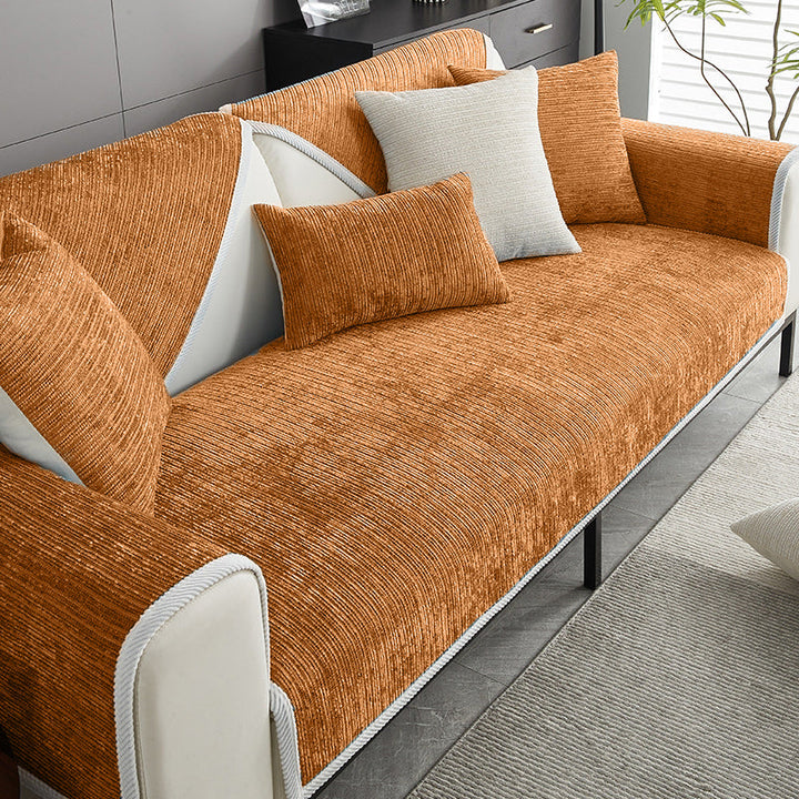 Elegant waterproof couch protector draped over a white sofa, providing durable, easy care, stylish home decor.