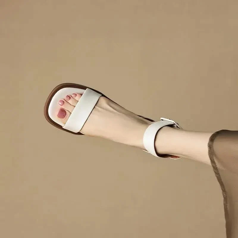 White elegant strap block heels for women. Stylish anklestrap dress sandals, comfortable fashion footwear.