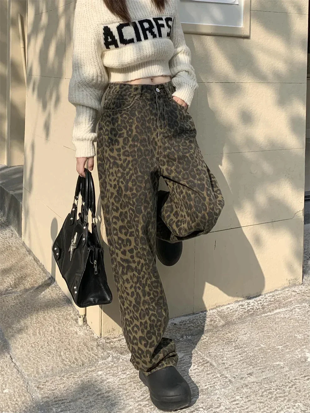 Stylish women's leopard print denim jeans, perfect for casual wear. Bold animal print design adds a trendy fashion statement.