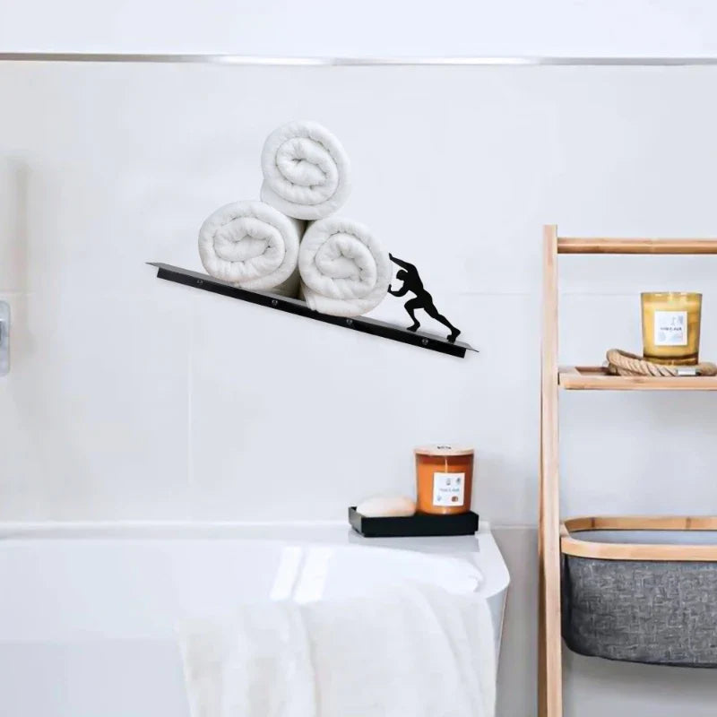 Compact freestanding bathroom shelf with playful design, offering storage for toilet paper, towels & decorative items.