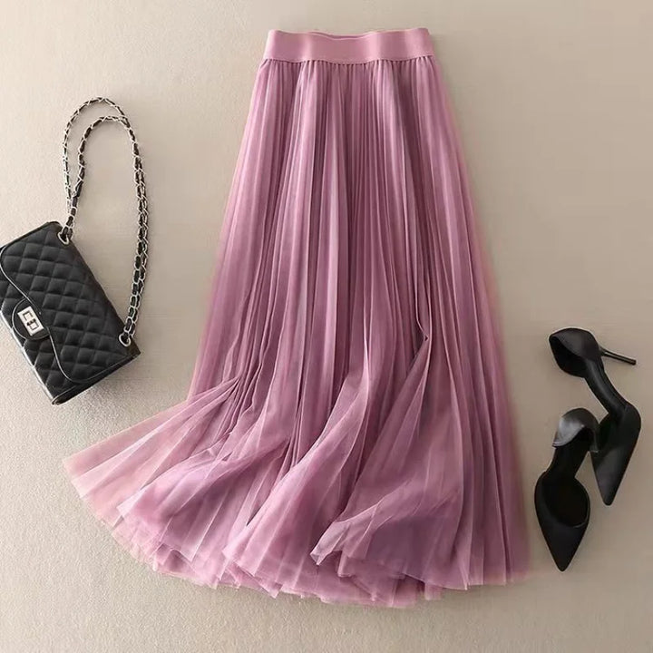 Chic women's high-waist pleated A-line midi skirt, flowy silhouette, ideal for elegant or casual spring/summer styles.
