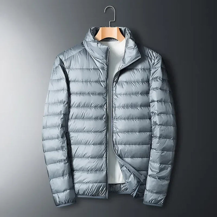 Lightweight unisex packable puffer jacket for hiking & camping. Provides warmth for cold weather outdoor adventures.