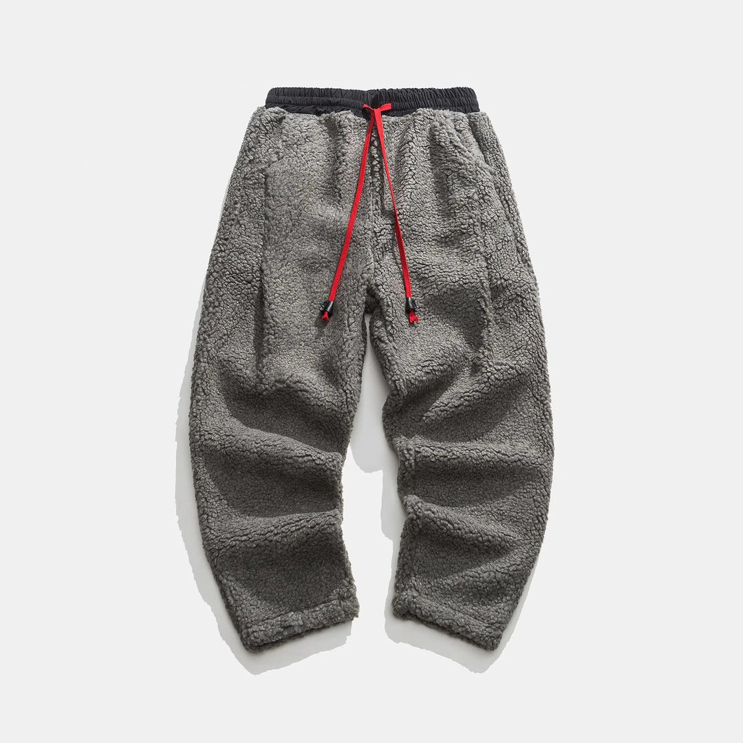Men's relaxed fit sherpa joggers with adjustable drawstring waist, offering cozy comfort & stylish casual wear.