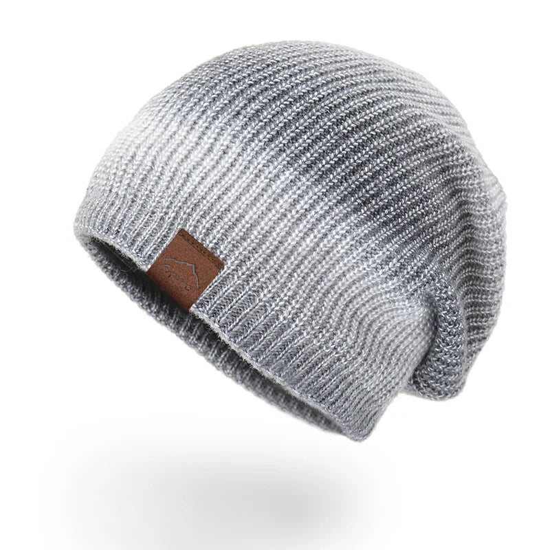 Unisex rainbow knit beanie, a vibrant and warm accessory for any winter fashion look.