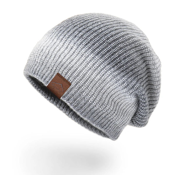 Unisex rainbow knit beanie, a vibrant and warm accessory for any winter fashion look.