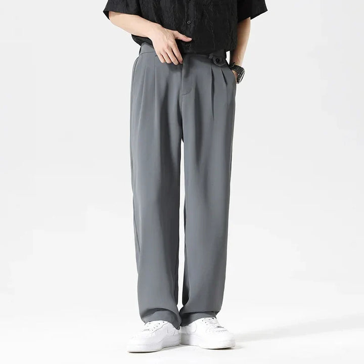 Black men's relaxed fit dress pants, wrinkle resistant, straight leg, versatile for formal or business casual.