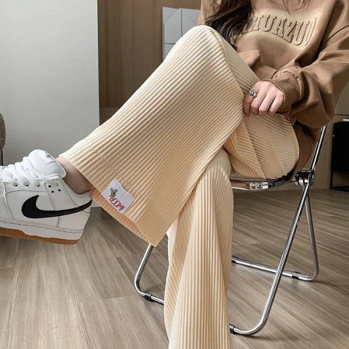 Comfortable high-waist ribbed maternity pants, perfect for relaxing or casual outings during pregnancy.