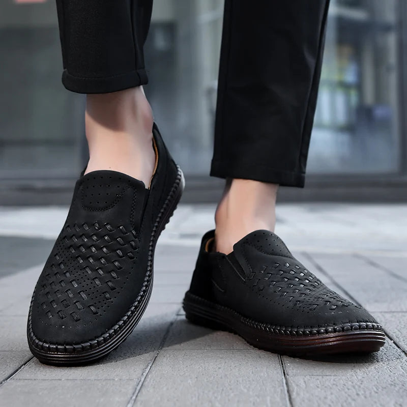 Man flexing the flexible outsole of men's comfort loafers, highlighting ease of movement.