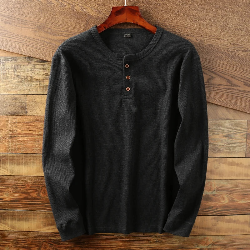 Detailed shot of soft, textured waffle knit. Men's comfortable casual long sleeve shirt.