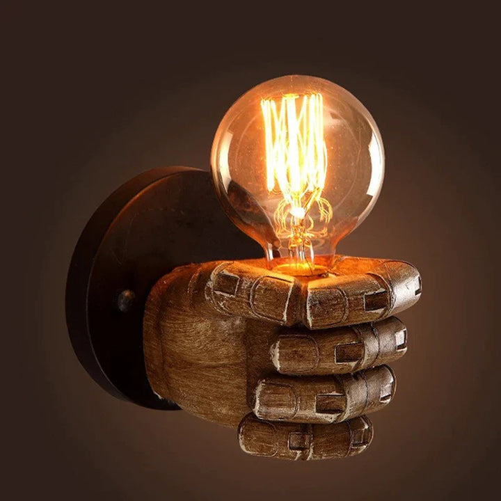 Unique sculpted fist wall light, a bold statement piece for artistic home decor & commercial spaces.
