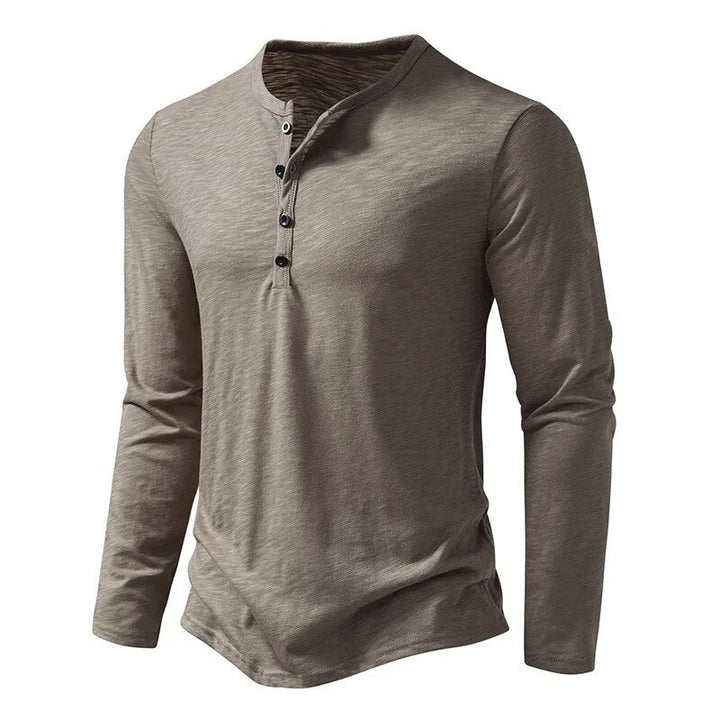 Comfortable men's slim fit henley shirt. Soft cotton blend for everyday style. Classic long sleeve.