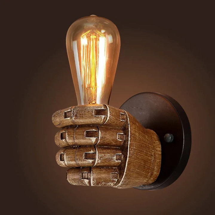 Industrial style fist wall sconce. Resin lamp provides unique artistic lighting for any room or business.