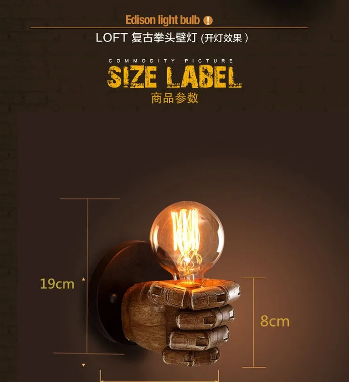 Statement sculpted fist wall sconce, an artistic resin lamp perfect for unique industrial home lighting.
